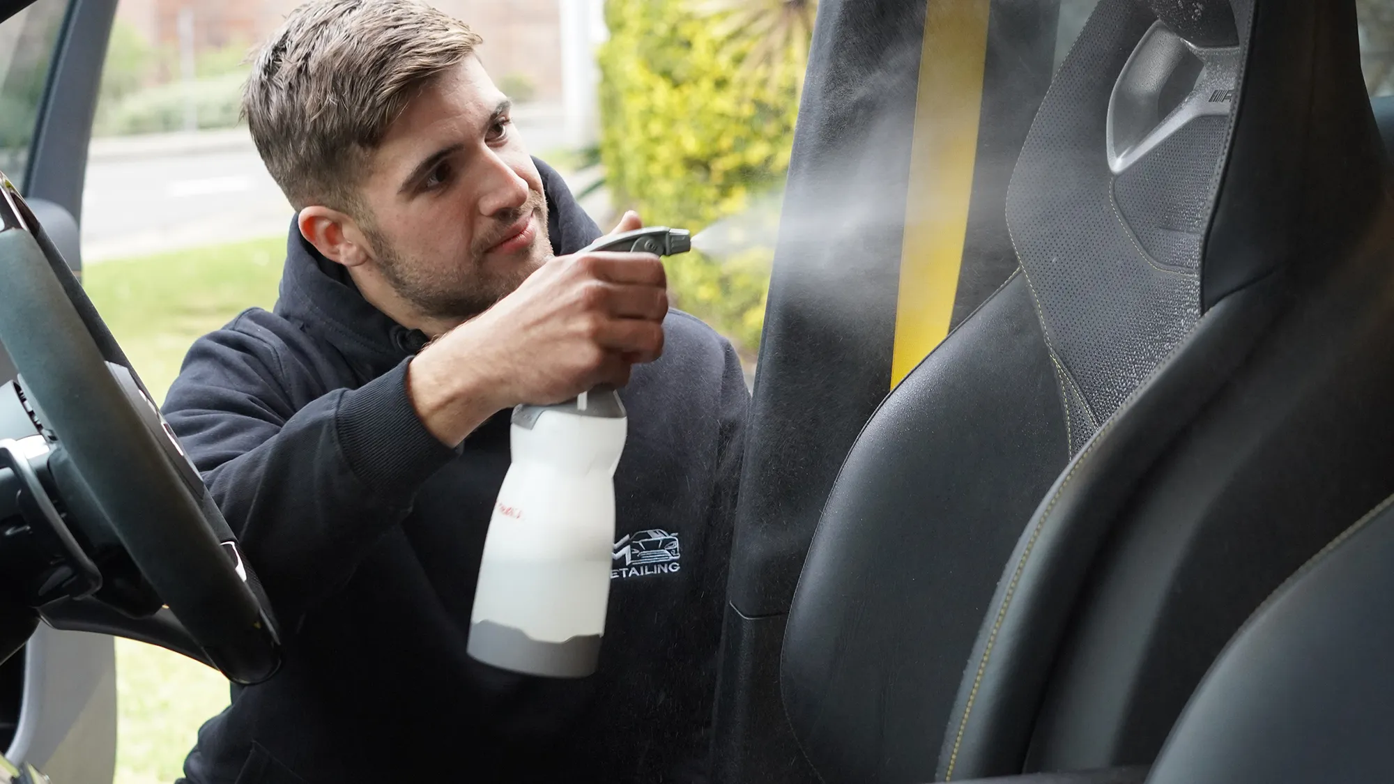 Vehicle exterior receiving a careful professional detailing treatment