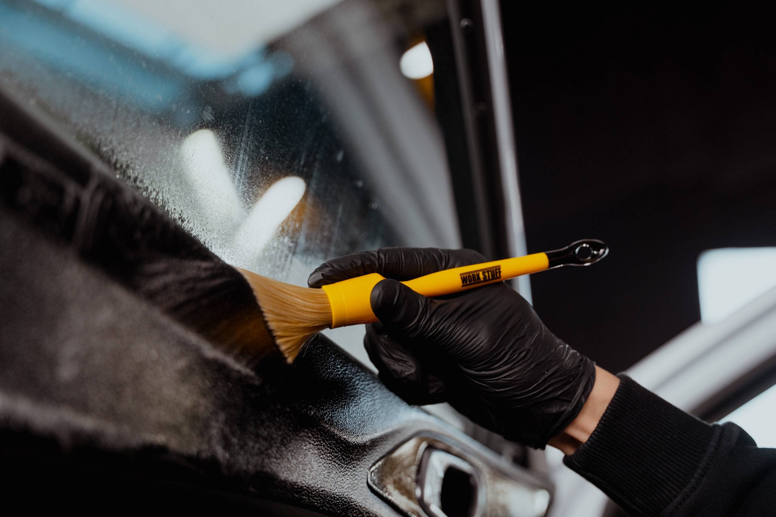 Vehicle care workspace prepared for professional detailing and interior cleaning