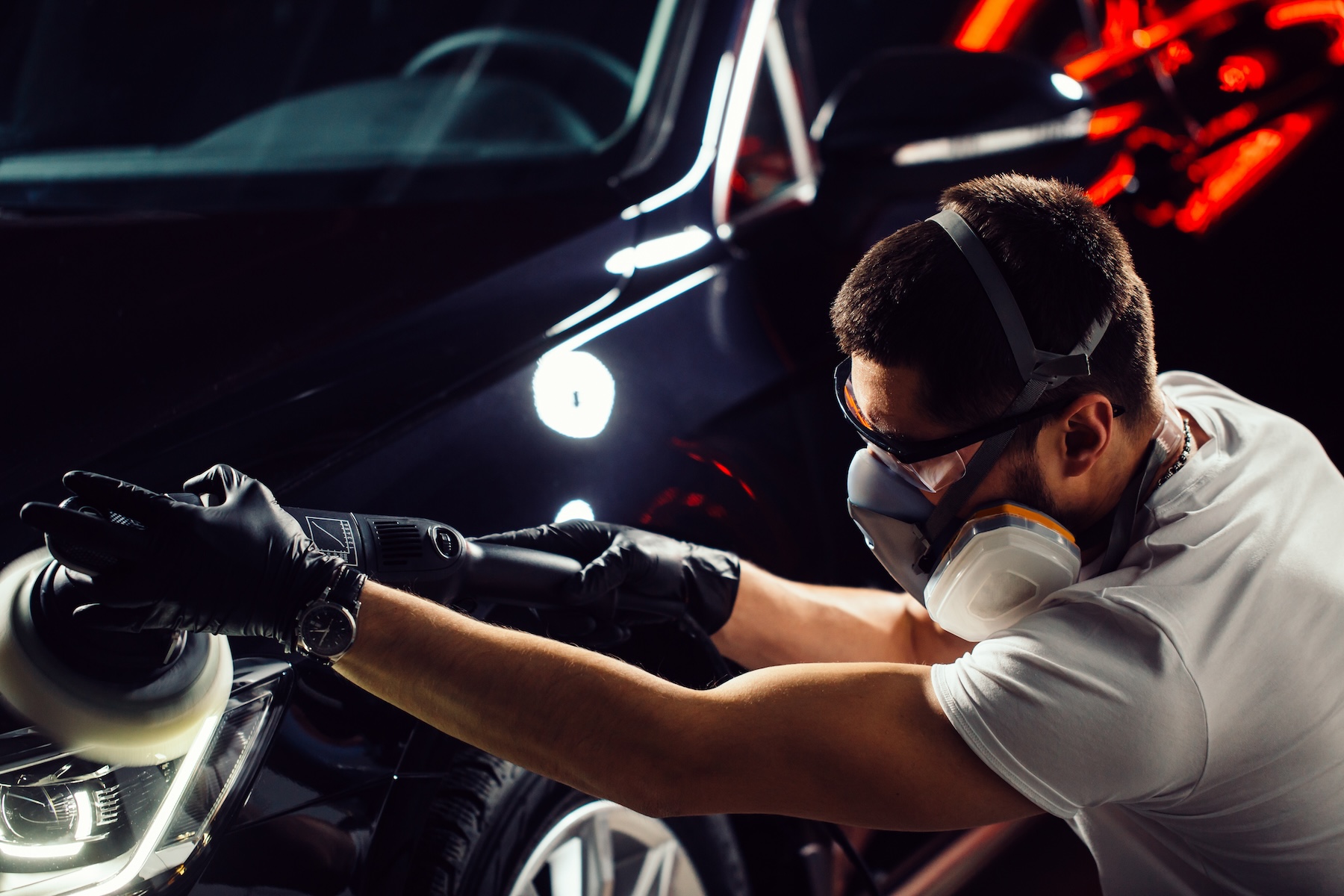 Professional vehicle detailing workspace prepared for interior and exterior car care